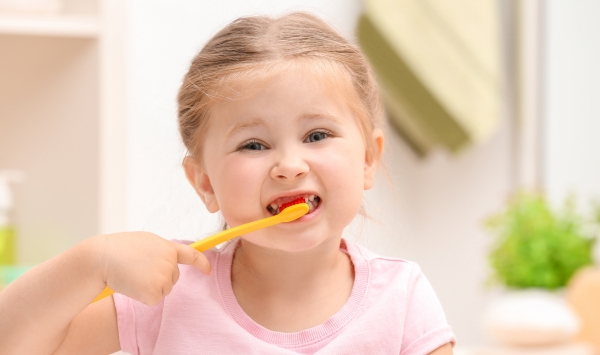 Child brushing teeth, paediatric health at Paradise Compounding Pharmacy