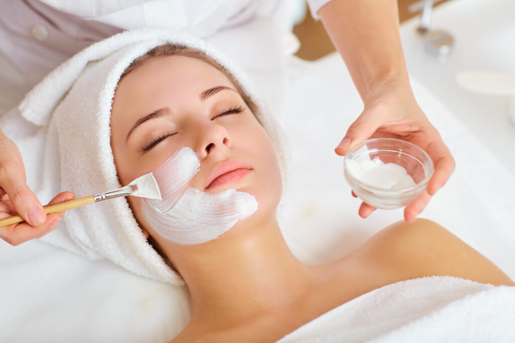 Compounded dermatology cream being applied during a skin treatment