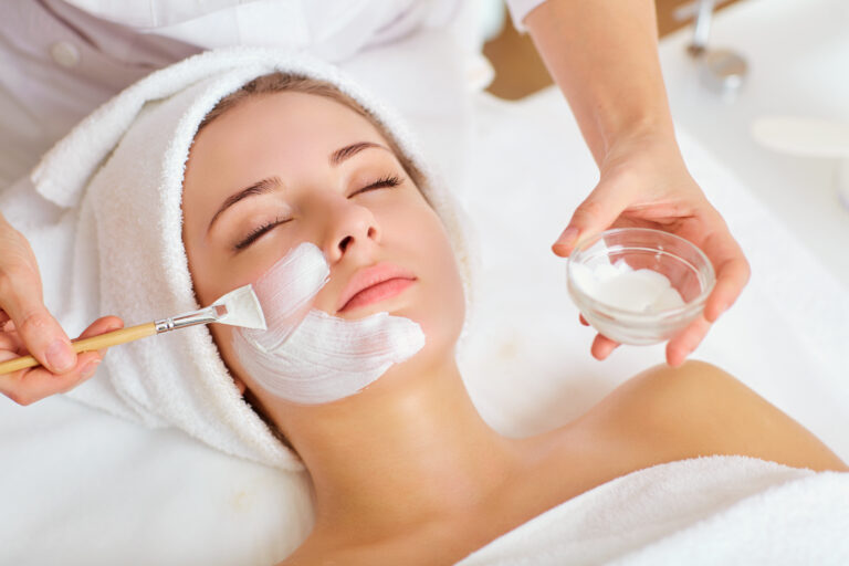 Compounded dermatology cream being applied during a skin treatment