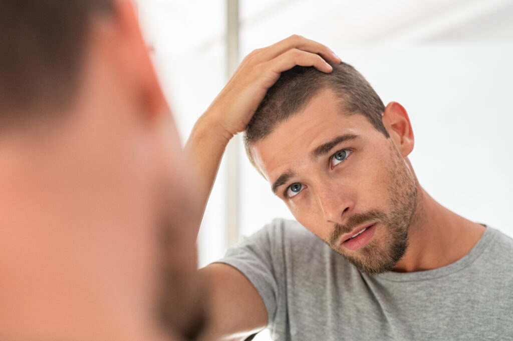 Man considering quitting smoking, supported by pharmacists at a Gold Coast pharmacy