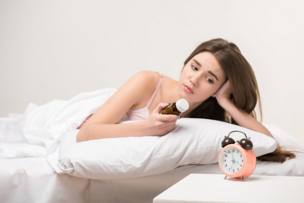 Woman awake at night who may be prescribed a compounded sleep support medicine